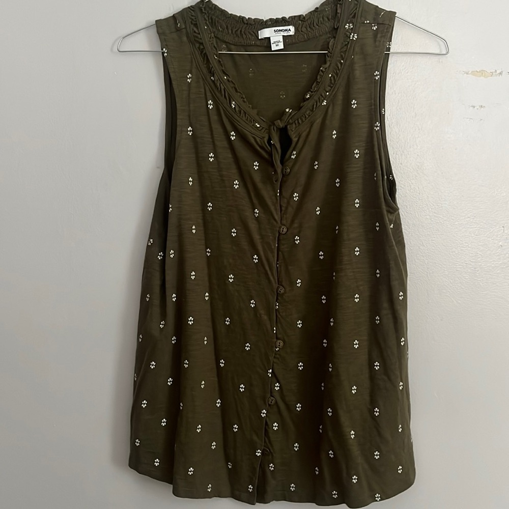 Green sleeveless top with white details